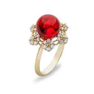 Gold ring with an amber ball in the color of a shiny cherry with zircons.