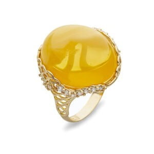 Gold ring with a unique amber eyelet with cubic zircons