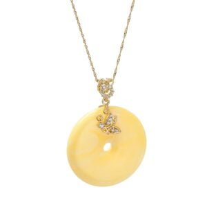 Unikatowa złota zawieszka bursztynowa w kształcie donata z cyrkoniami